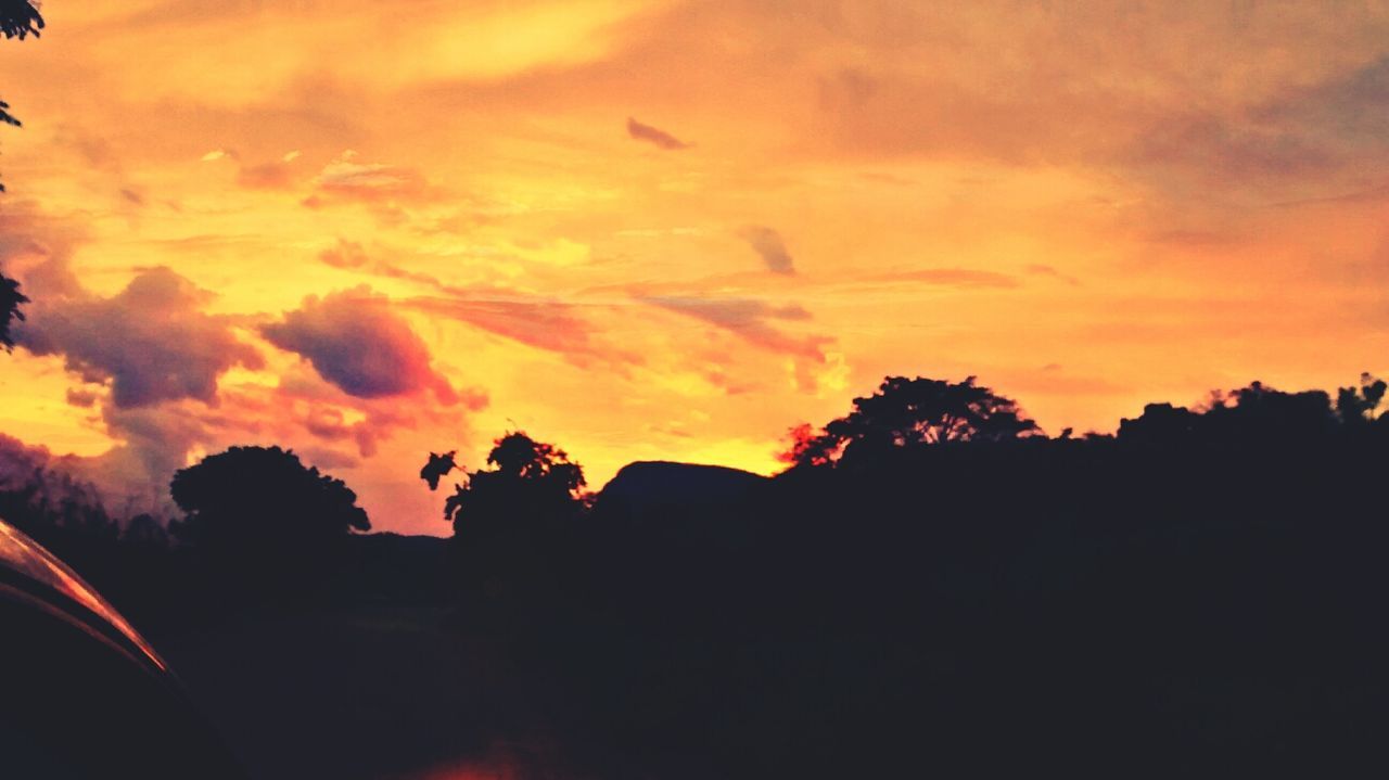 sunset, silhouette, orange color, sky, beauty in nature, scenics, tree, tranquil scene, cloud - sky, tranquility, nature, idyllic, dramatic sky, outdoors, cloud, moody sky, no people, dark, landscape, dusk