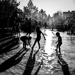 People playing in fountain