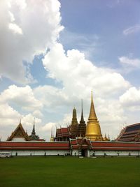 Low angle view of temple against cloudy sky