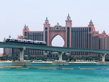 Bridge over river with buildings in background