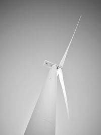 Low angle view of wind turbine against clear sky