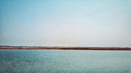 Scenic view of sea against clear sky