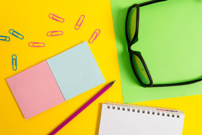 High angle view of yellow paper on table