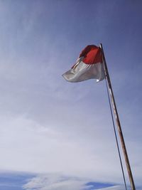 Low angle view of flag indonesia against sky