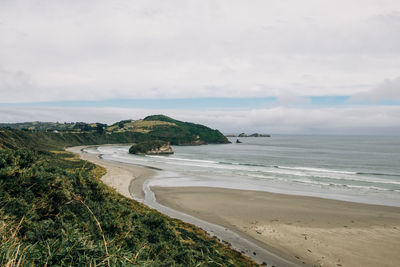 Scenic view of beach against sky