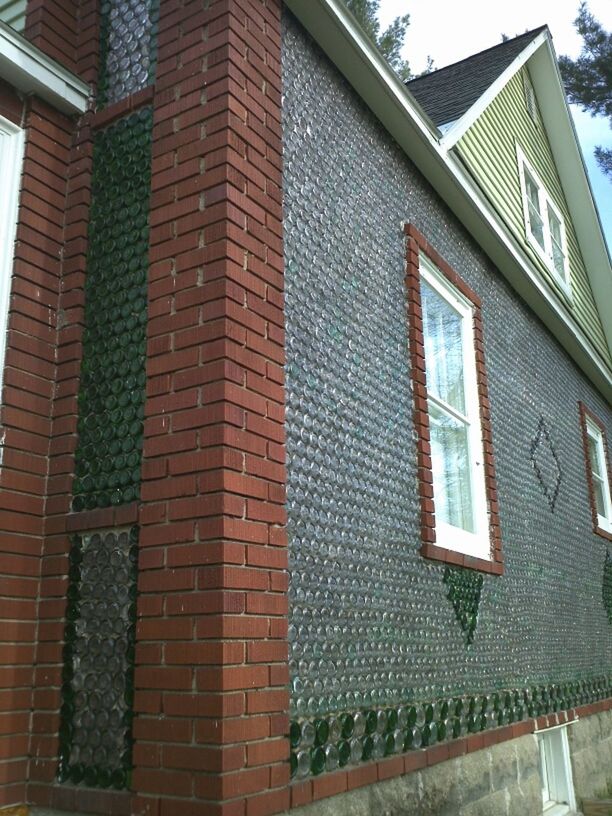 building exterior, architecture, built structure, window, low angle view, residential building, building, residential structure, house, day, brick wall, outdoors, no people, facade, wall - building feature, city, sunlight, glass - material, door, sky