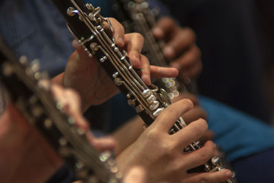 Midsection of people playing guitar