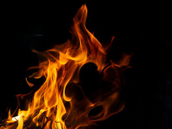 Close-up of bonfire against black background