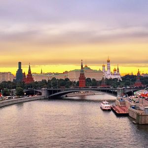 Bridge over river at sunset