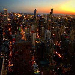 Aerial view of illuminated buildings in city