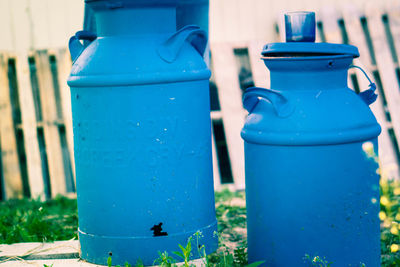 Close-up of blue canisters