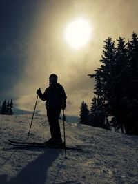 Silhouette of woman against sky