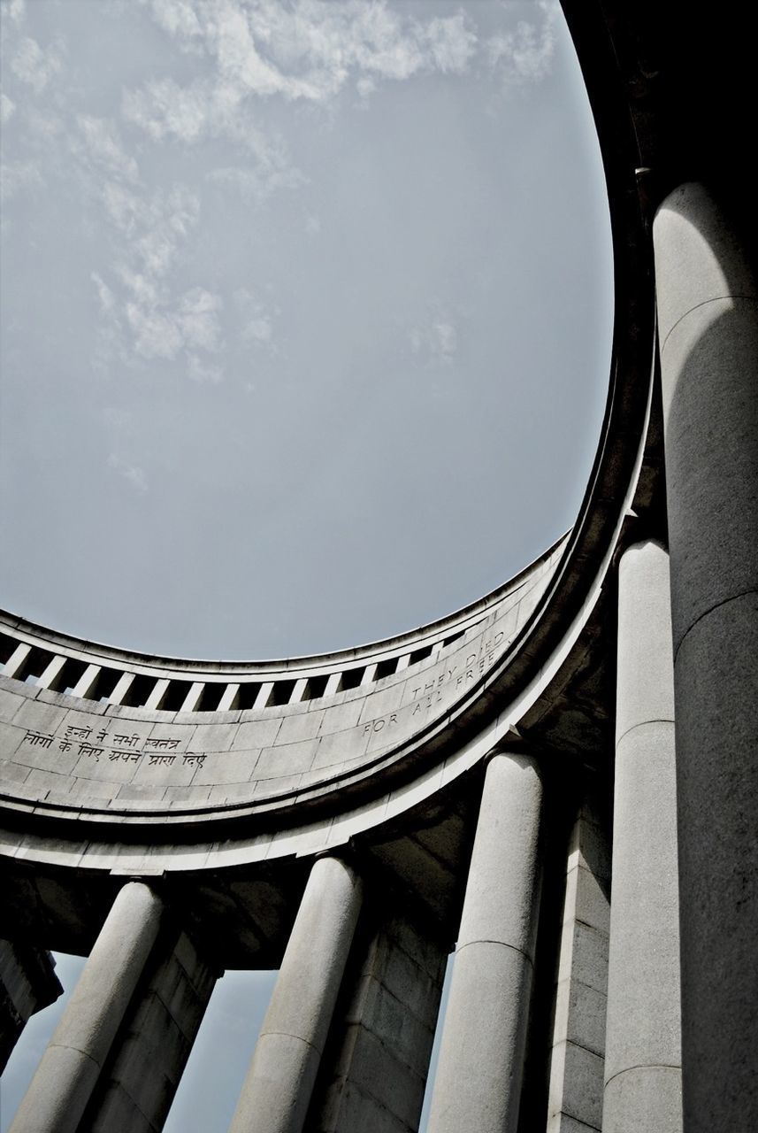 low angle view, architecture, built structure, sky, history, architectural column, building exterior, column, arch, cloud - sky, famous place, international landmark, travel destinations, cloud, no people, day, architectural feature, travel, the past, outdoors