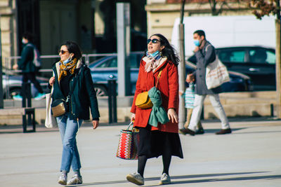 Full length of woman walking in city