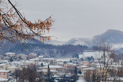 View of townscape against sky during winter