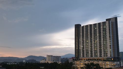 Low angle view of buildings against sky during sunset