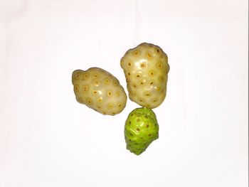 Close-up of fruits against white background