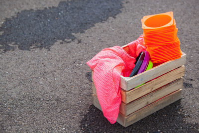 High angle view of toys in crate on road