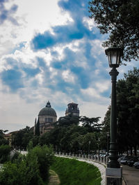 Low angle view of building against cloudy sky