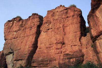 Low angle view of rock formation against sky