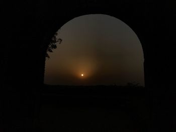 Silhouette tree against sky at night