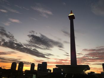 Silhouette tower against sky during sunset