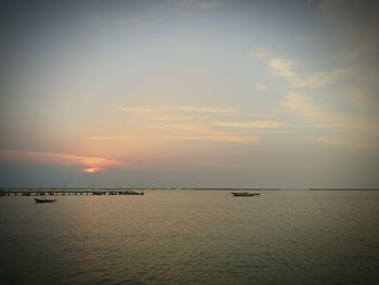 Scenic view of sea against sky at sunset