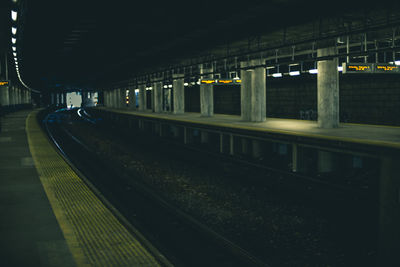 Illuminated railroad station at night