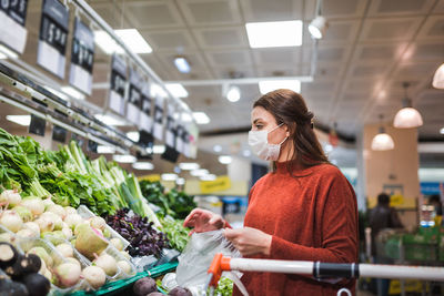 Full length of woman standing at market