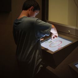 Boy using digital signage