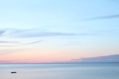 Scenic view of sea against sky at sunset