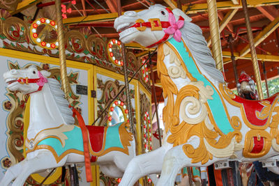 Low angle view of carousel in amusement park