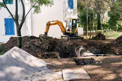 Construction site by road in city