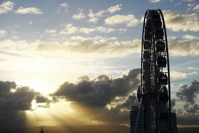 Low angle view of ferris wheel against sky