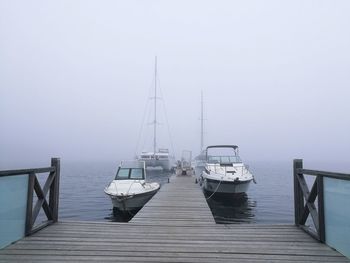 Pier over sea against sky