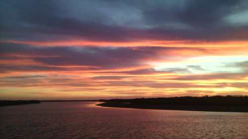 Scenic shot of calm sea at sunset