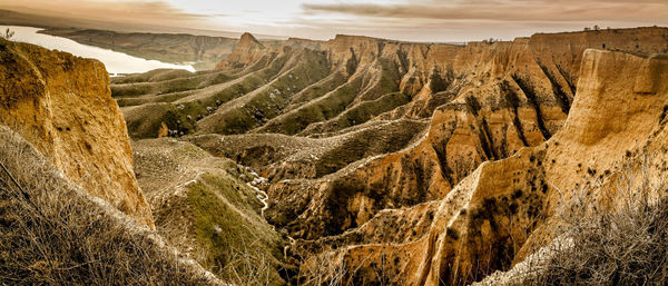 Panoramic view of landscape against cloudy sky