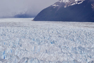 Scenic view of glacier against sky