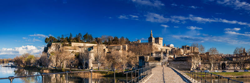 Bridge over river against blue sky