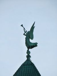 Low angle view of statue against clear sky