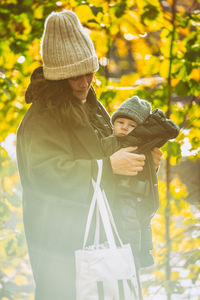 Woman with umbrella on plants