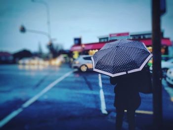 Man on road against sky