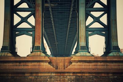 Low angle view of brooklyn bridge in city