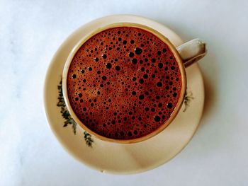 High angle view of coffee cup on table