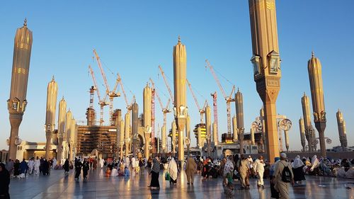 Group of people in temple against buildings