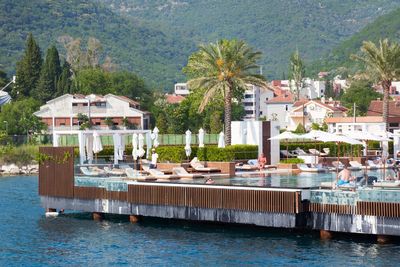 Houses by swimming pool in sea