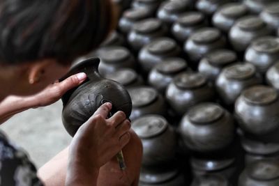 High angle view of potter making pots at pottery workshop