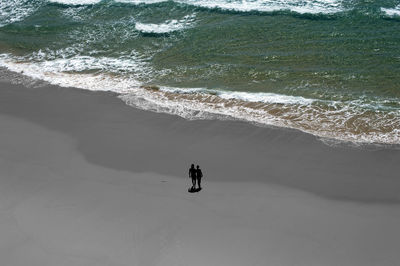 Woman jumping on shore