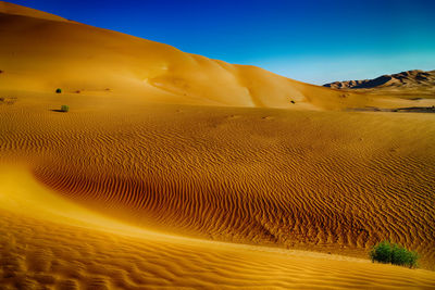 Scenic view of desert against clear sky