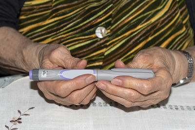 Close-up of man using mobile phone